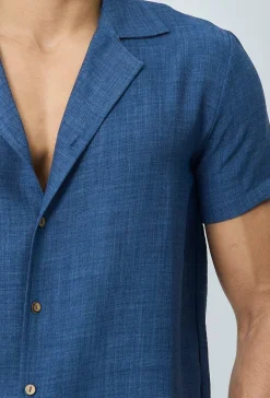 Chemise manches courtes à bouton