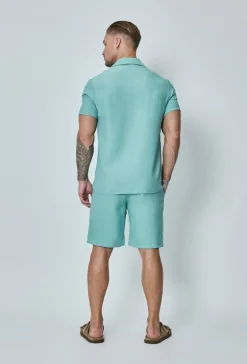 Chemise manches courtes à bouton