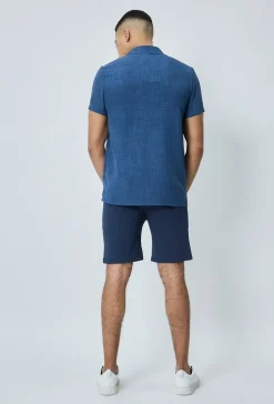 Chemise manches courtes à bouton