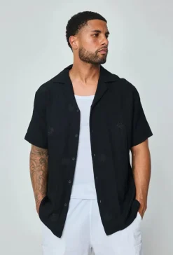 Chemise manches courtes à motifs fleuris