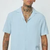 Chemise unie à boutons manches courtes