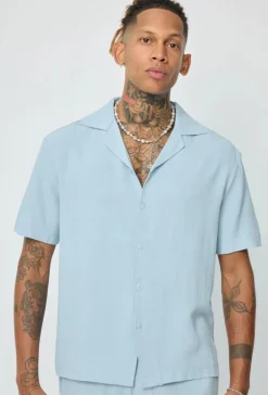 Chemise unie à boutons manches courtes
