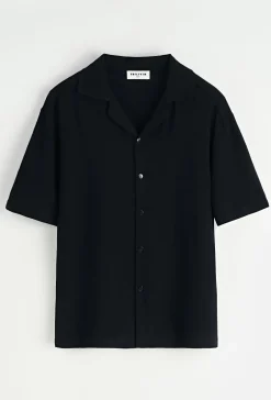 Chemise unie à boutons manches courtes