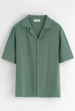 Chemise unie à boutons manches courtes