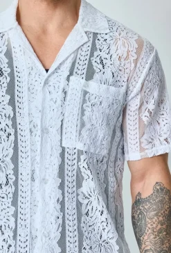 Chemise unie en dentelle manches courtes col à revers