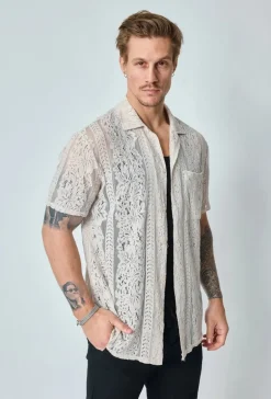 Chemise unie en dentelle manches courtes col à revers