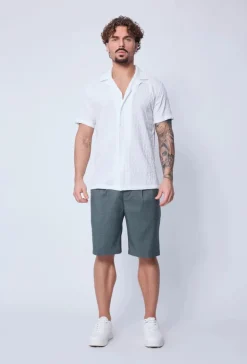 Chemise unie manches courtes à motifs géométriques