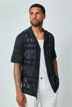Chemise unie manches courtes à motifs