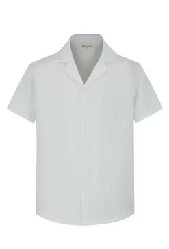 Chemise unie manches courtes à motifs géométriques