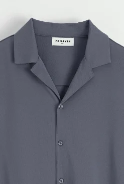 Chemise unie manches courtes