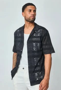 Chemise unie manches courtes à motifs