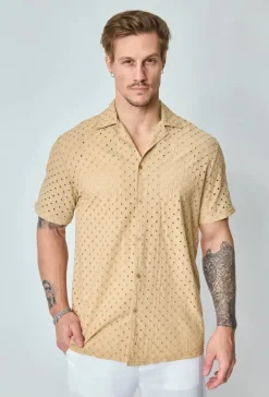 Chemise unie trouée manches courtes