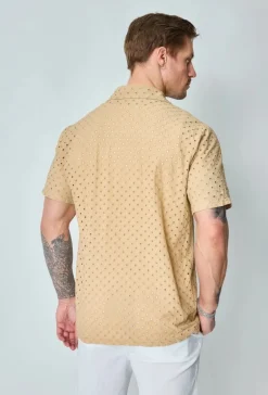 Chemise unie trouée manches courtes