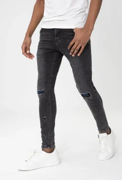 Jean effet déchiré avec empiècement