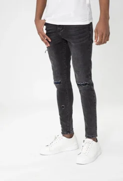 Jean effet déchiré avec empiècement