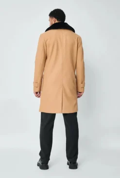 Manteau boutonné col à fourrure