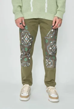 Pantalon droit uni avec patch géométrique
