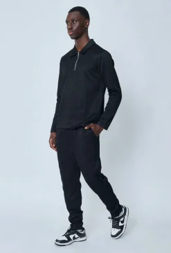 Polo couleur uni manche longue à zip