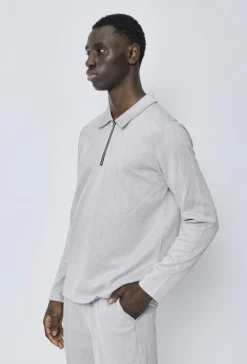 Polo couleur uni manche longue à zip