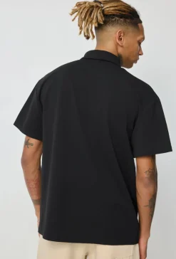 Polo uni manches courtes