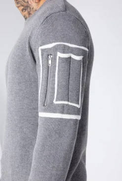 Pull à manches longues avec design carré et zip sur la manche