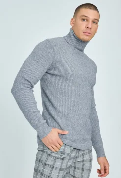 Pull col roulé maille cotelé