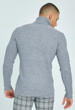 Pull col roulé maille cotelé