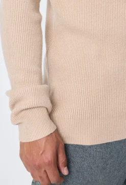 Pull col roulé maille cotelé