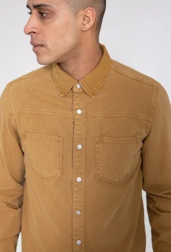 Surchemise jean cintrée à col classique avec finition usée
