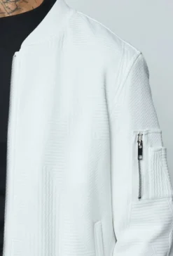 Veste teddy uni motifs géométriques